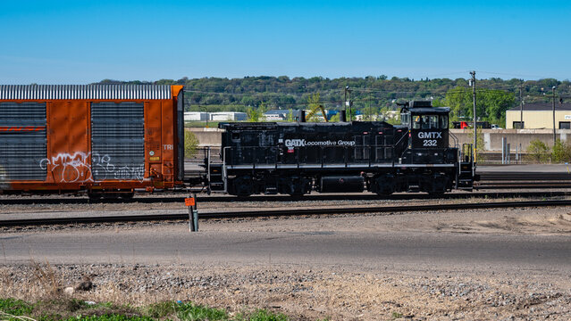 Saint Paul, Minnesota, USA - May 3, 2026 - GATX Locomotive Group (GMTX) switcher 232 switches cars at the Pigs Eye Yard on a sunny spring day.