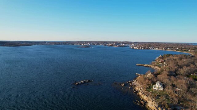 Aerial view of coastal residences, rocky shoreline, and ocean near Gloucester, Massachusetts, USA