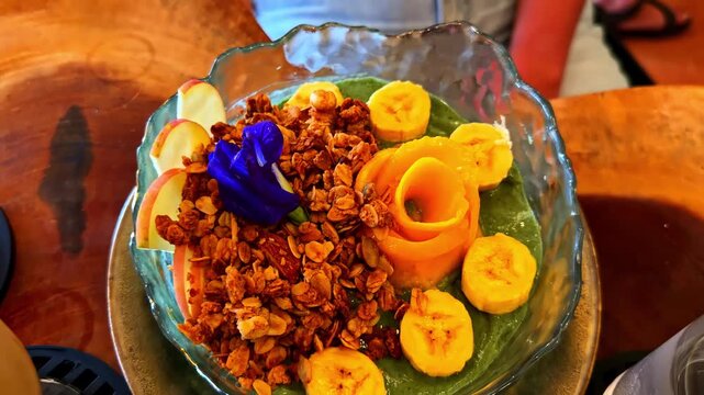 Tropical breakfast with smoothie bowl and eggs in Catangnan island