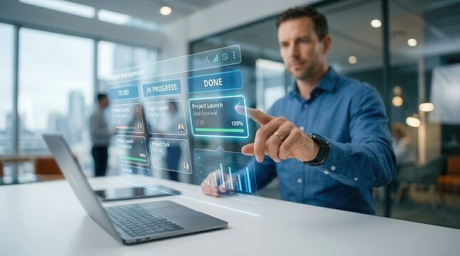 A professional working on a design marketing project plan using a laptop and digital task management tools.