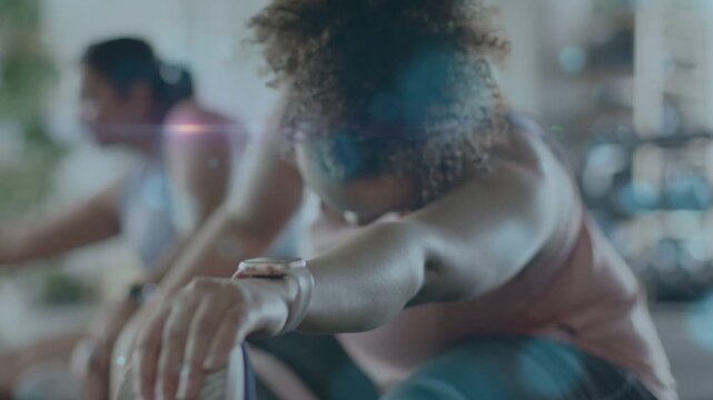 Woman reaching shoe and holding stretch in gym activating motion lines guiding posture for mobility
