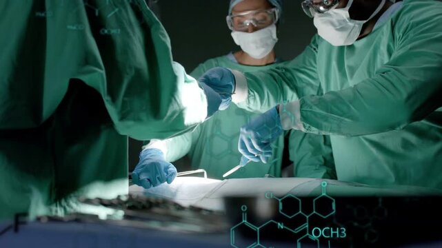Surgeon starting incision under light OR team handing clamp with turquoise overlays guiding surgery