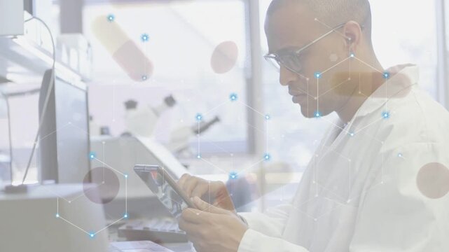 Lab tech tapping tablet at bench, creating data network and capsules covering profile for study