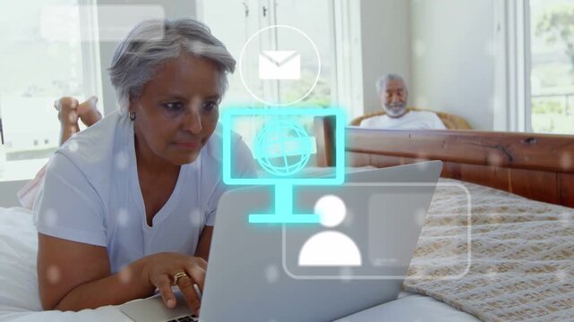 Senior woman typing laptop, causing cyan globe tech UI and mail icon floating, checking email