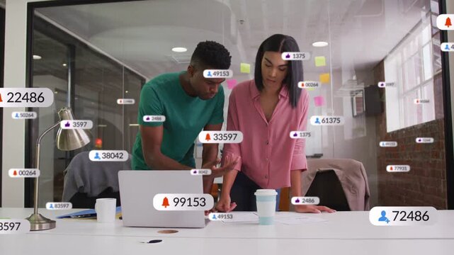 Two coworkers leaning over laptop man tapping phone causing alerts rising across glass for business