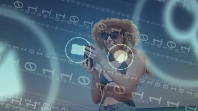 Woman posing selfie on beach, tech icons appearing and causing lowering phone, tapping and reading