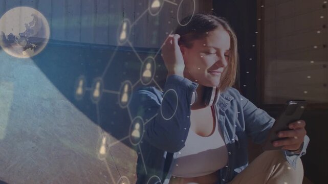 Woman sitting, glancing at phone and swiping, summoning AR globe, UI panels, contacts for tech demo