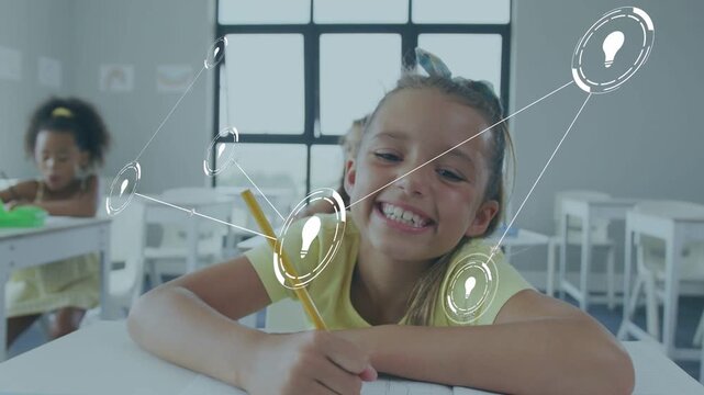 Girl writing in classroom, glancing up and watching AR lightbulb network growing across workbook