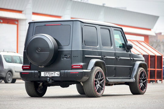 Minsk, Belarus - March, 17 2026: Mercedes-AMG G 63 Edition 1 features a 4.0L V8 biturbo engine with 585 hp. Matte black Magno finish with red accents on wheels grill and mirror caps, urban background