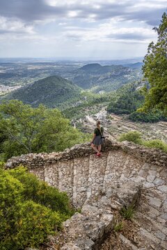 Hiker on the trail to Castell d Alar&oacute;, Puig dalar&oacute;, Majorca, Spain