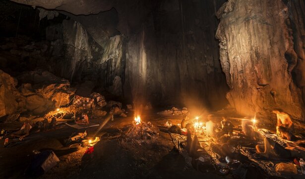 Hikers, tourists sleeping in a cave with a campfire, Kuala Tahan, Taman Negara National Park, Malaysia