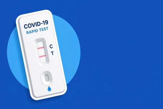 COVID 19 rapid test kit on blue background with visible control and test lines in a minimal studio composition