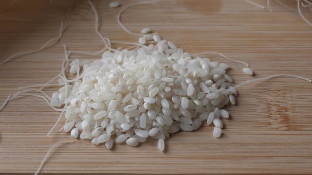 Rice and noodles on a wooden board, close-up food concept
