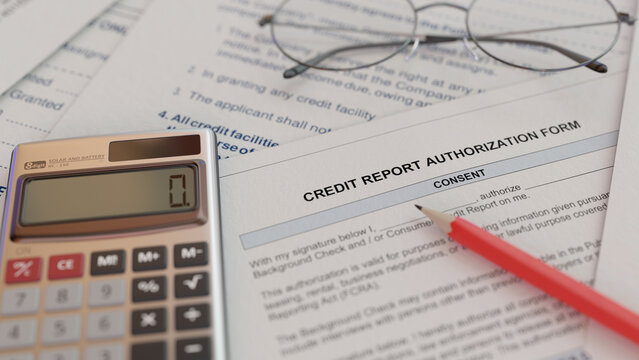 Credit Report Authorzation Form with pencil, calculator and glasses on desk