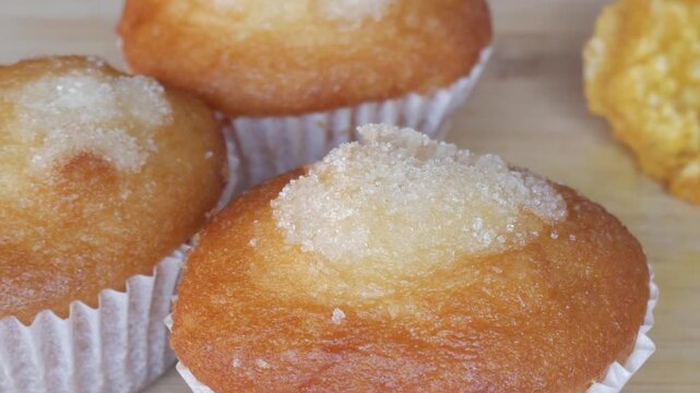 Fresh muffins on table, sunlight highlights cozy mood with Tejas touch