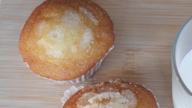Sugary muffins on wood, comforting homemade baking joy