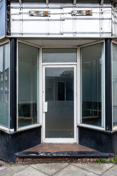 Closed down shop with removed shop sign
