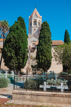 cypress trees frame the cemetery of Lerins Abbey