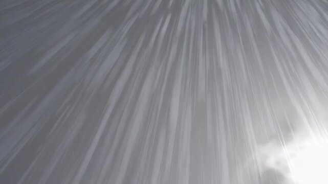 [Rain falling from the sky] [in cinematic style] [in grey and white tones] [representing a stormy weather atmosphere] [with copy space]
