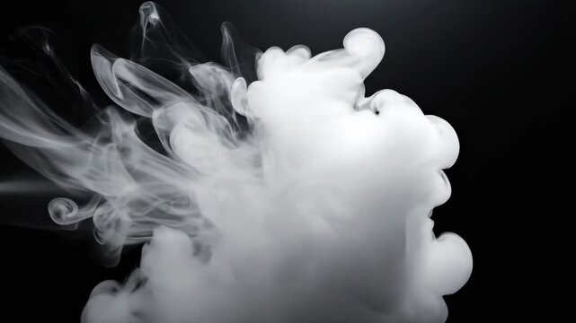 White smoke puff and swirling vapor cloud isolated on a black background for abstract design.