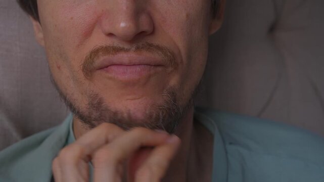 Man scratching his beard with hand, high quality uncompressed audio recording. Subtle hair friction sound and natural gesture. Grooming habit, thinking and everyday lifestyle concept.
