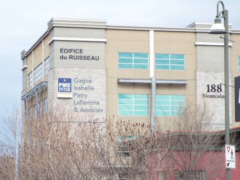 Gatineau, Quebec, Canada &ndash; March 11, 2026: The "&Eacute;difice du Ruisseau" office building in Gatineau features signage for PME Inter Notaires and is located at 188 Montcalm.