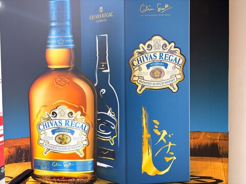 Chivas Regal Mizunara Special Edition blended Scotch whisky advertisement poster featuring blue packaging and gold calligraphy in Chiyoda district - Tokyo, Japan, December 22, 2025