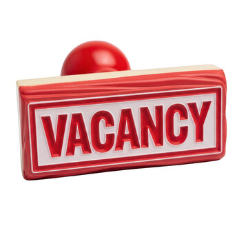 Red rubber stamp with the word vacancy embossed in white letters on black background