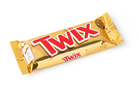 Twix chocolate bar in gold wrapper on white background