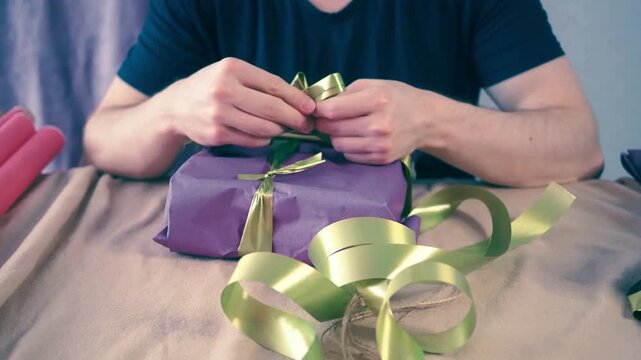 a man wrapping birthday presents