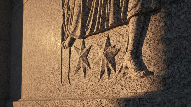 Close-up view of a stone statue's carved starry base and leg