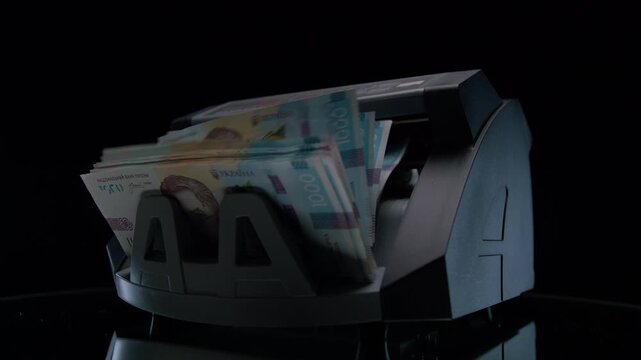 Money Counter Processing Ukrainian Banknotes