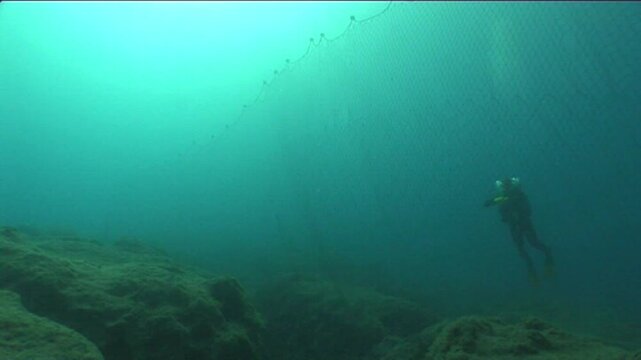 ghost hunting fish net so big underwater fisherman pollution underwater garbage environmental harming oceans driftnets