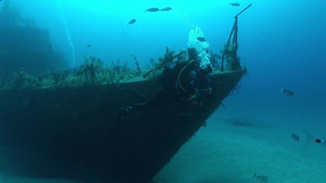  shipwreck scenery underwater ship wreck deep blue water ocean scenery of metal underwater scuba divers to explore