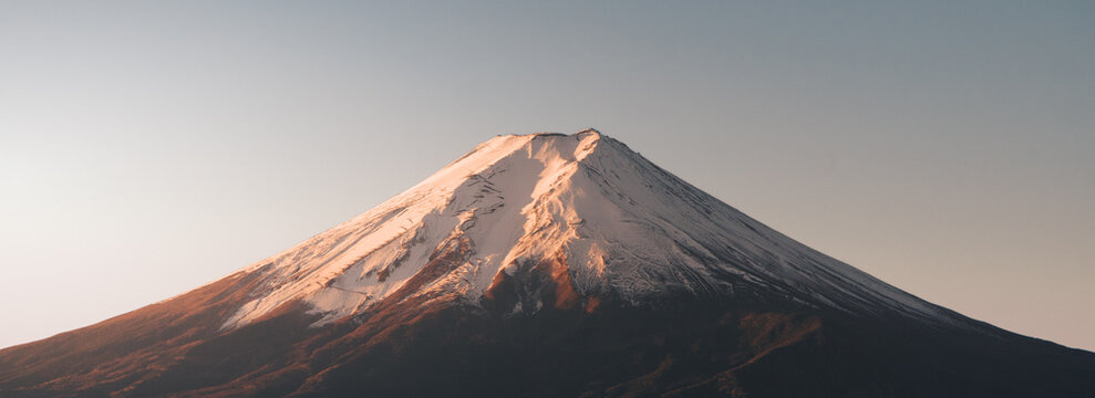 Mount Fuji Snow Capped Summit Close Up Alpenglow Sunrise Light Gradient Sky Japan