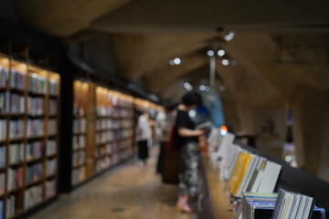 Abstract blurred bookshelves with books, manuals and textbooks on bookshelves in library or in book store © Sopear