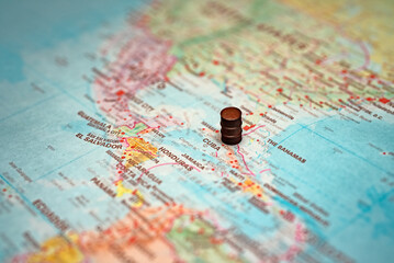 Naklejka premium Small oil barrel placed on Cuba map.