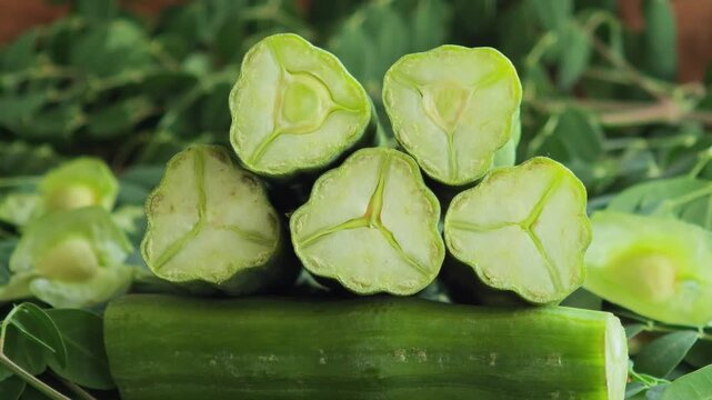   Fresh moringa pods, an herb.