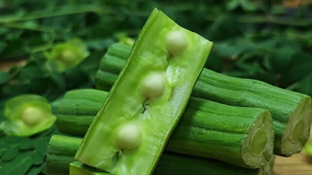   Fresh moringa pods, an herb.