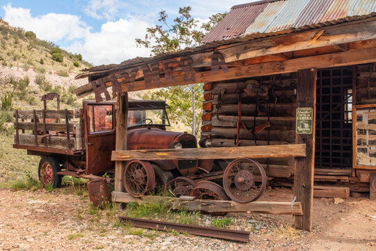 Ghost Town in Jeremy, Arizona with old cars, trucks and mining equipment and old buildings