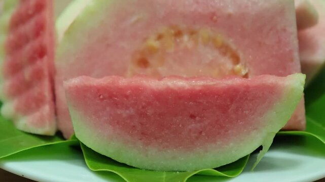 The guava has red flesh inside.