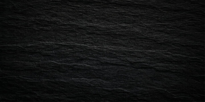 Dark grunge black paper texture and rough fabric material background featuring a macro grain pattern on a weathered wooden surface backdrop