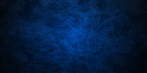 Obraz premium A dark blue grunge paper texture background features a vintage aged wall pattern with a rough dirty surface design suitable for a black chalkboard backdrop or old metal board wallpaper