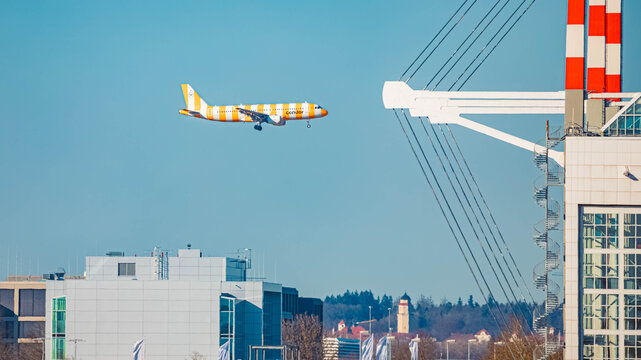 D-ATCH Condor Airbus A320 passenger jet airplane with special white and orange livery on a sunny winter day approaching Munich airport, MUC, Freising, Bavaria, Germany