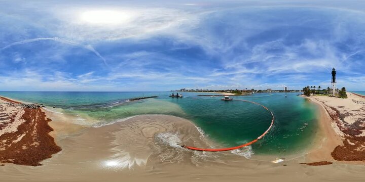 Dredging barge and jetty at the Hillsboro Inlet Florida aerial 360 VR 8k stock video 2026