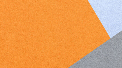 Fototapeta premium Orange textured paper background with light blue gray triangular corners and copy space. Template for presentation, banner