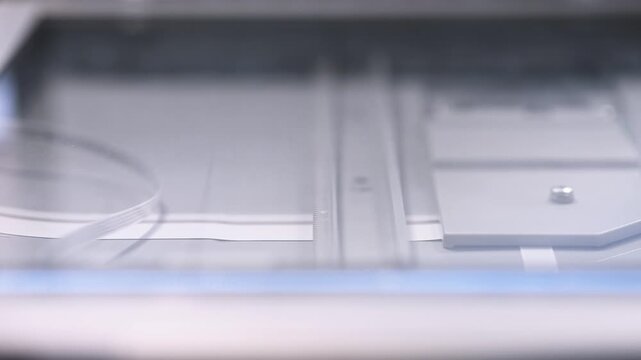 Close up of modern flatbed scanner optics and mechanical components with soft lighting