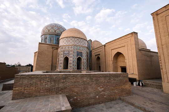 Shah-i-Zinda medieval Islamic architecture in Samarkand, Uzbekistan. Eastern funerary complex with blue tile mausoleums. Central Asian monumental buildings.