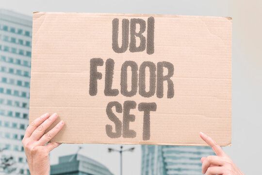 "UBI Floor Set" A guaranteed minimum income creates an economic floor below which no citizen's living standard falls. MINIMUM. ECONOMIC. FLOOR. CITIZEN. STANDARD.