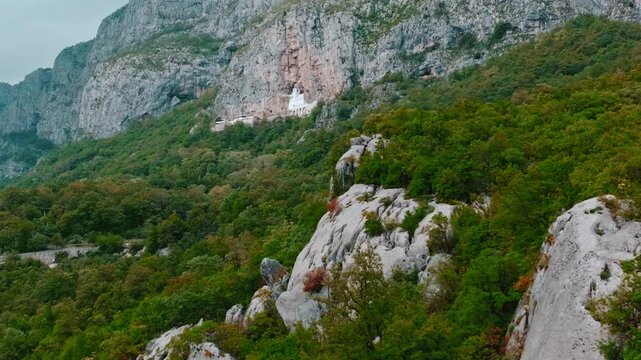 Cinematic footage of the famous Ostrog Monastery in Montenegro. Built into a dramatic cliffside, this iconic Orthodox monastery is one of the most important pilgrimage sites in the Balkans.